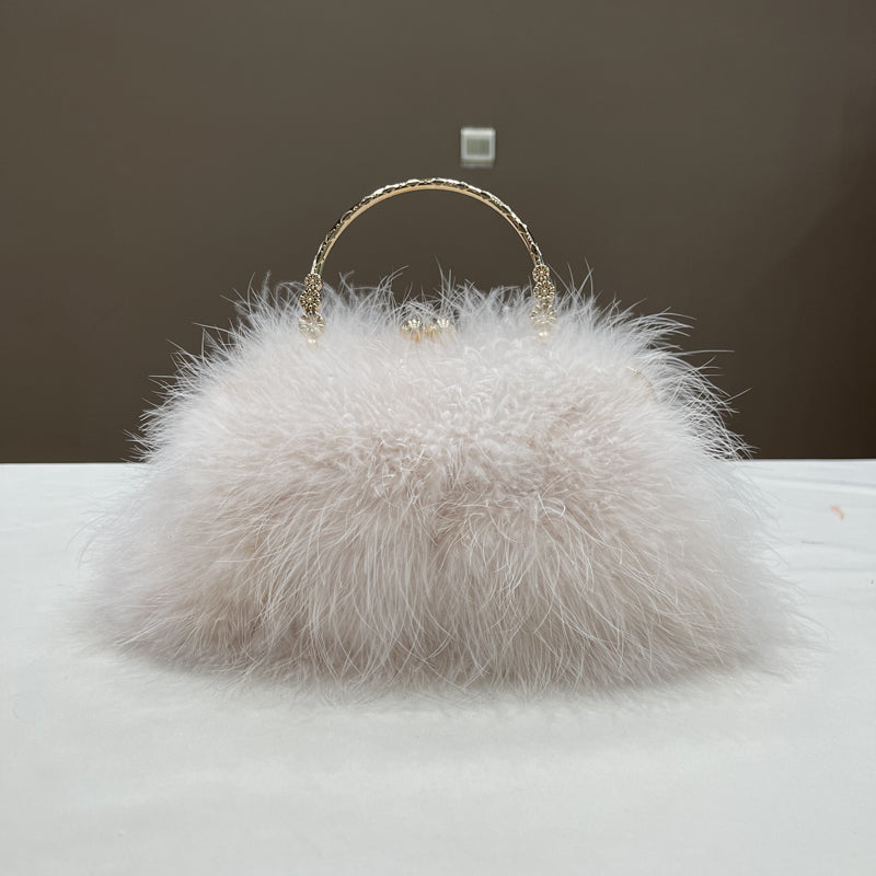 Women's handbags, feather handbags, turkey feather handbags, crossbody handbags, feather bags, handmade bags, real fur bags, handmade fur bags, wholesale and pattern making are available.